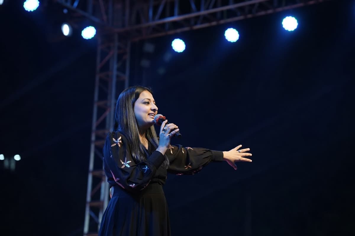 Vocalist performing on stage at a corporate event