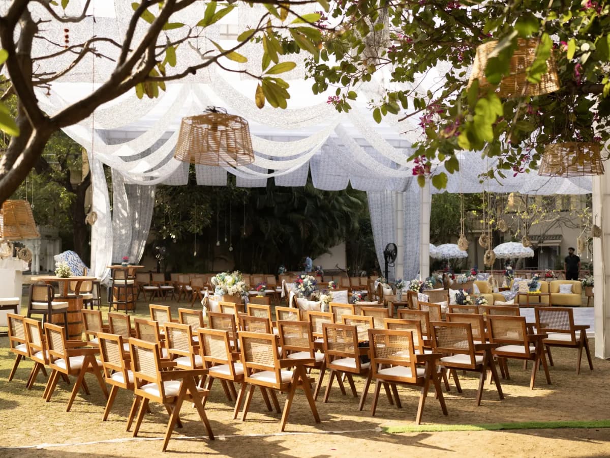 Outdoor wedding reception dinner under string lights
